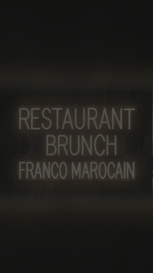 Vidéo du néon LED Restaurant Brunch Franco-Marocain blanc chaud qui s'allume sur un mur de restaurant